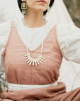 Model in Field Wearing Yucca Necklace