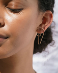 Gold gravity hoops by Baleen shown on a model
