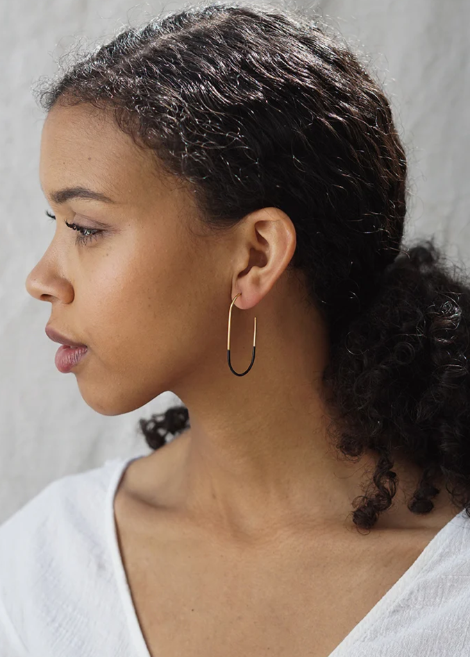 Gold Tulip Hoops by Baleen worn by a model