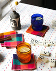Cute scene of colorful napkins and glasses on a table