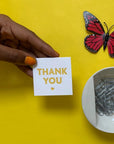 Woman holding a mini Thank You Card