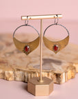 Gold Brass and Silver Madrasa hoop earrings with red stones by Claire Sommer Buck.