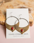 Gold Brass and Silver Madrasa hoop earrings with red stones by Claire Sommer Buck.