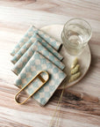 Set of Four Cocktail Napkins with Accessories Surrounding