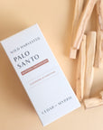 palo santo sticks on the right with the box in center