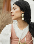 Model wearing Meadowlark earrings