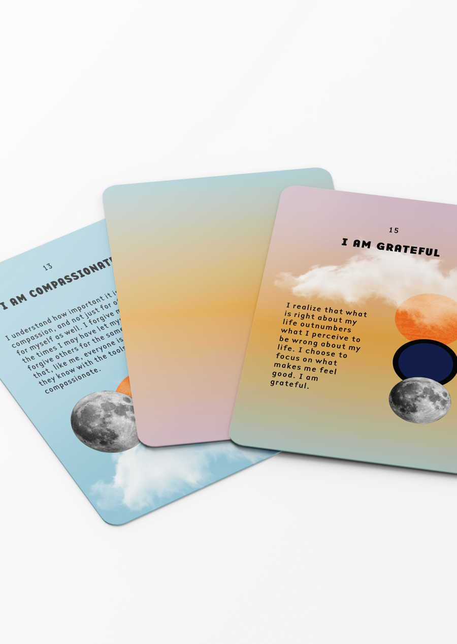 Three I AM Everything Affirmation Cards Laid out with One Faced Down