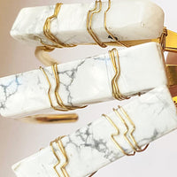 three howlite crystal cuff bracelets in hand