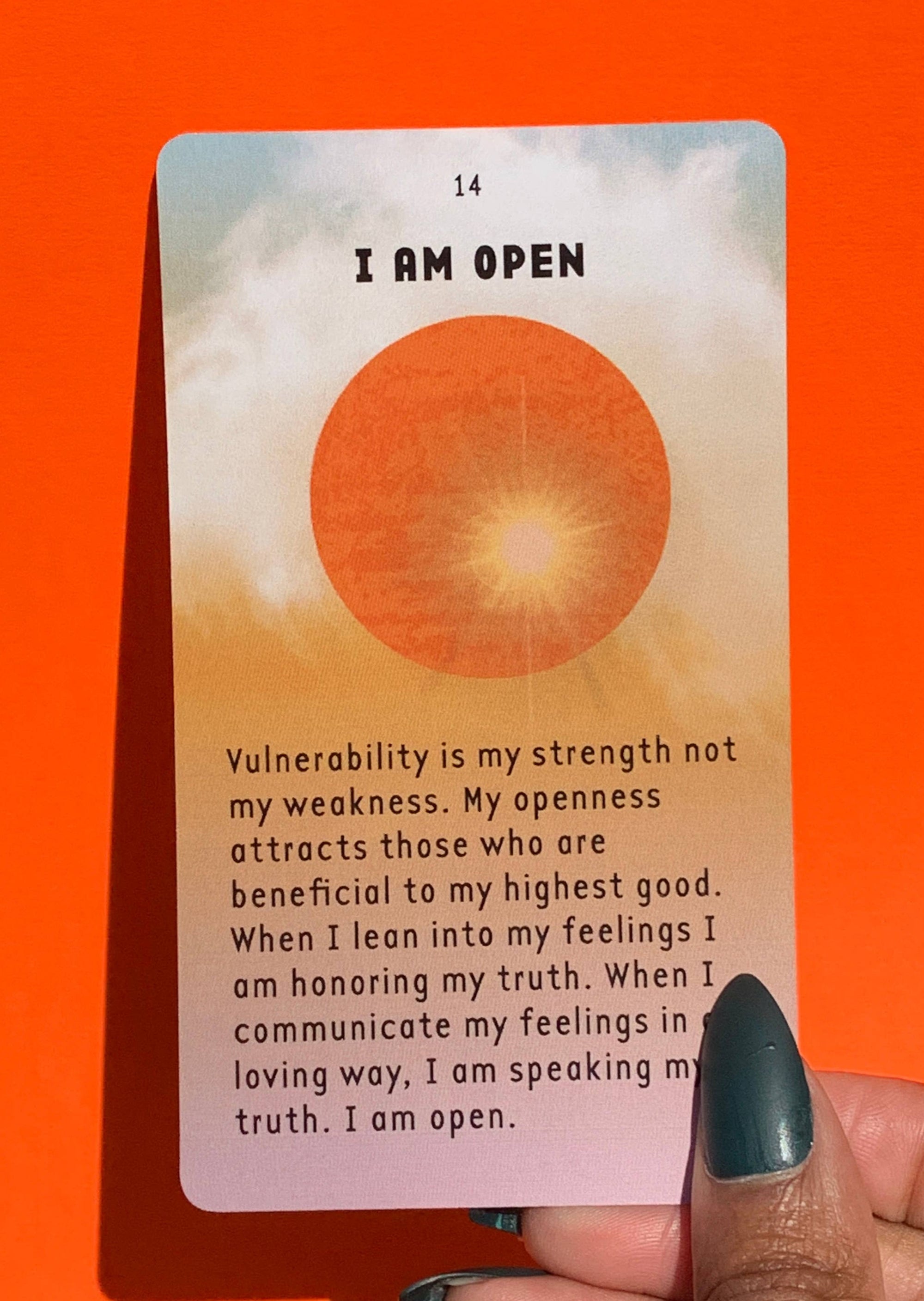 Model Holding an &quot;I Am Open&quot; Affirmation Card