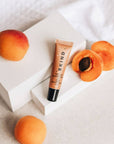 BKind Lip Balm in Berries With Apricots Surrounding
