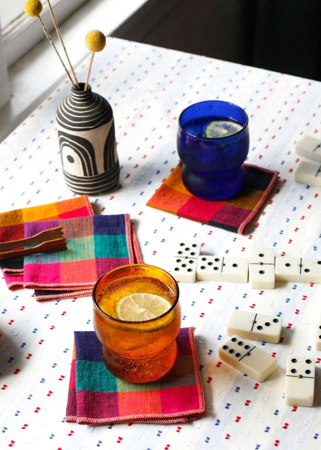 Cute scene of colorful napkins and glasses on a table