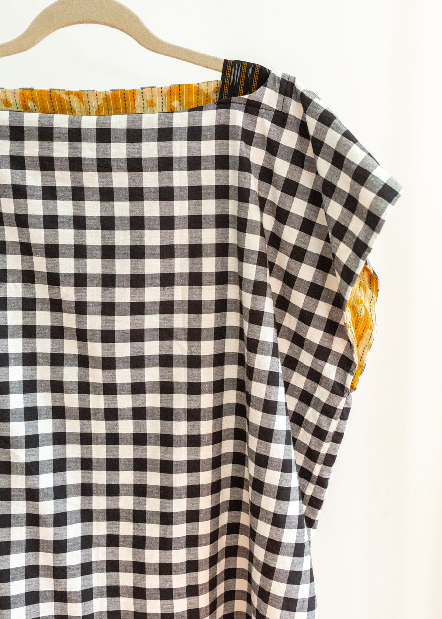Block print in black and white top with mustard details inside.