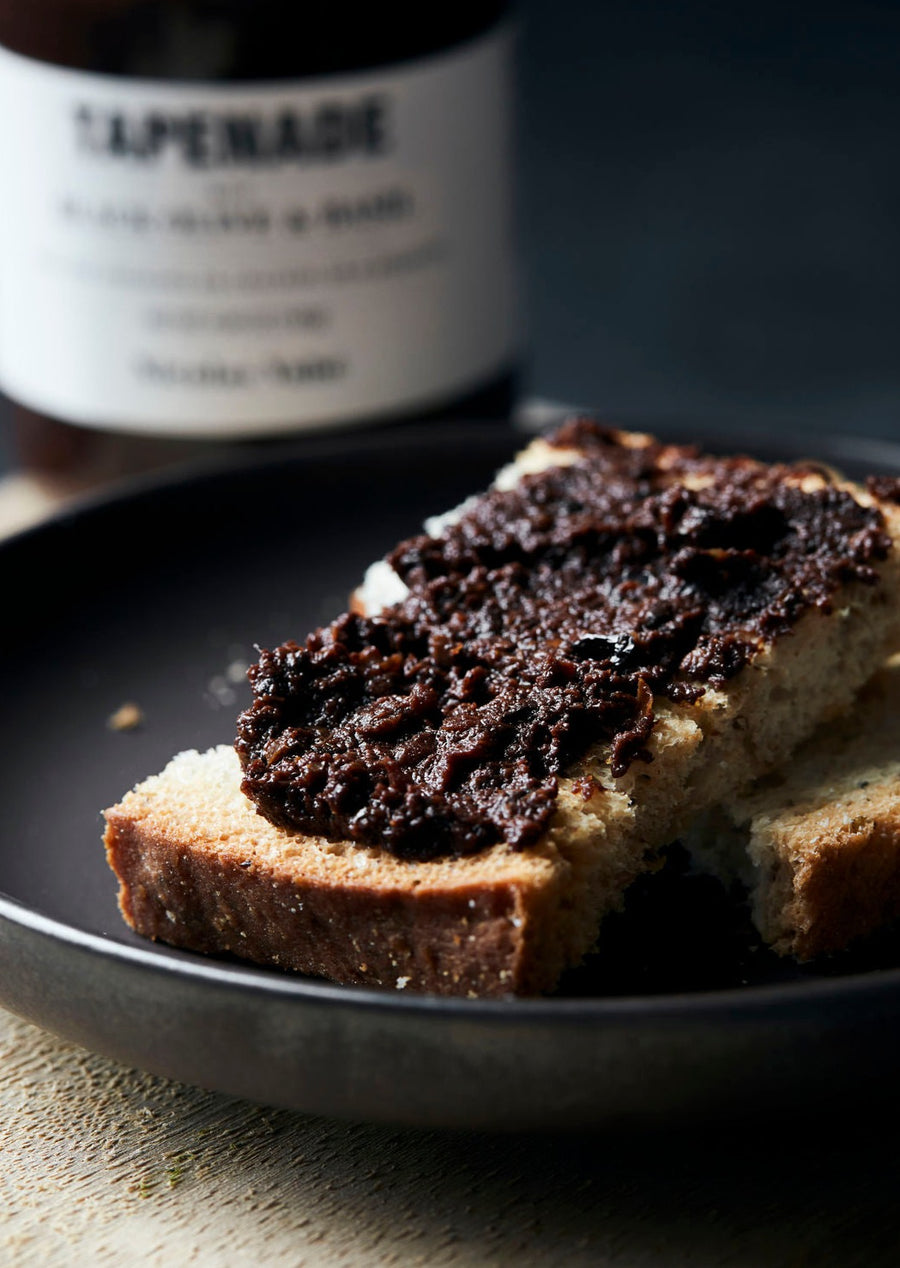 Slice of Bread with Black Olive and Basil Tapenade Spread