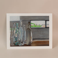 Photo of an art print with multiple glass bottles for an italian series. Standing on a light pink background