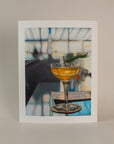 Art print of a high ball cocktail. Standing on a light pink background