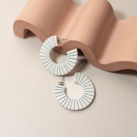 Blue Striped Hoops leaning on a stand