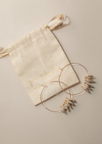 Pinched Bead Hoops next to canvas sack