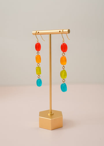 Danglying earrings on a gold stand with 4 beads, colored red, orange, green and blue