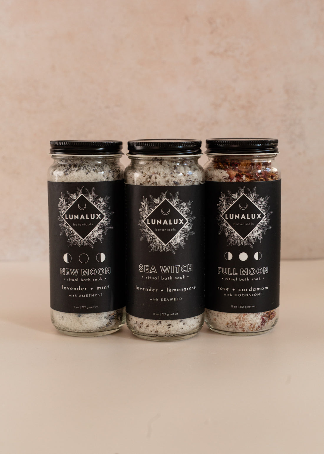 Three tall bath soak jars side to side with lavender & mint, lavender & lemongrass and rose & cardamom scents