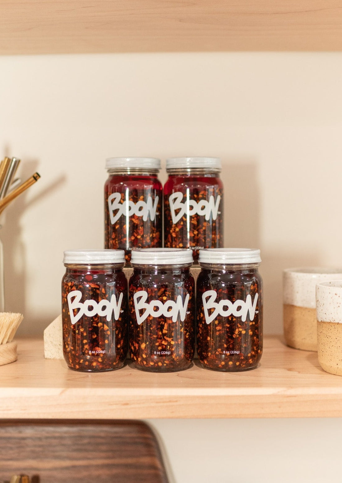5 Jars of Boon Sauce on a Shelf