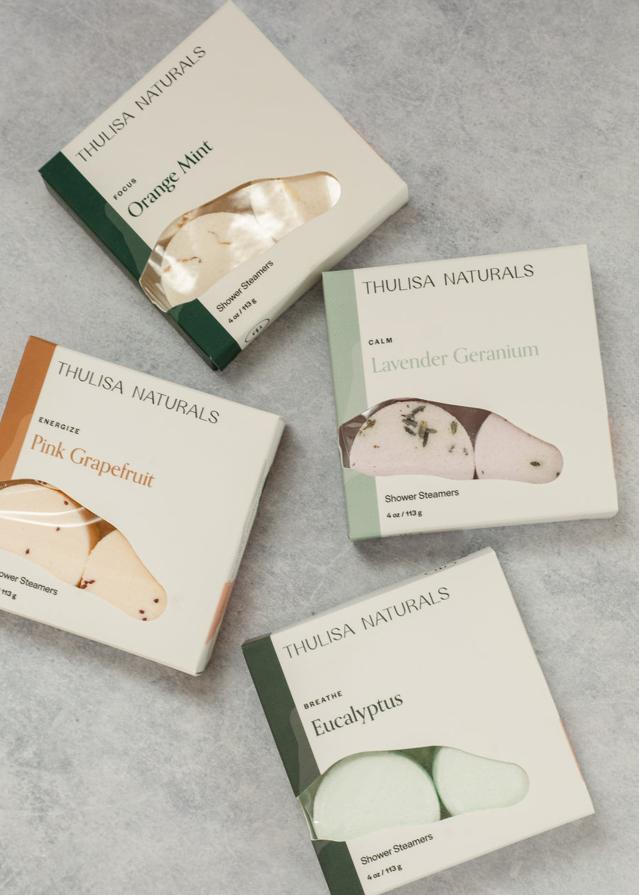 flatlay of multiple types of shower steamer boxes
