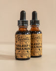 Two Amber Bottles of Asleep and Dreaming Tinctures