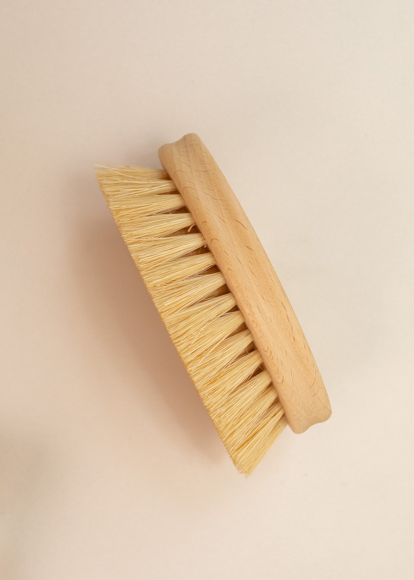 flat lay of an oval cleaning brush on it's side