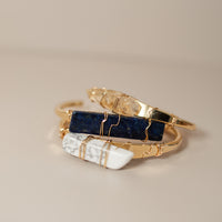 Three stacked crystal cuff bracelets