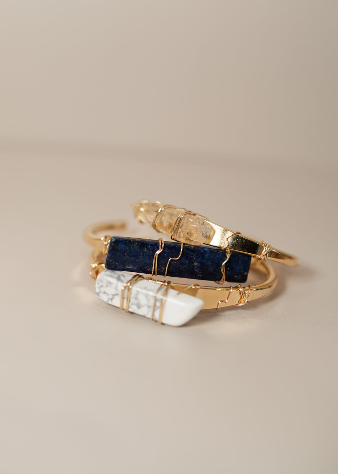 Three stacked crystal cuff bracelets
