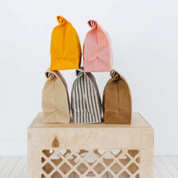 Five Eco-Friendly Lunch Bags on a Wooden Crate