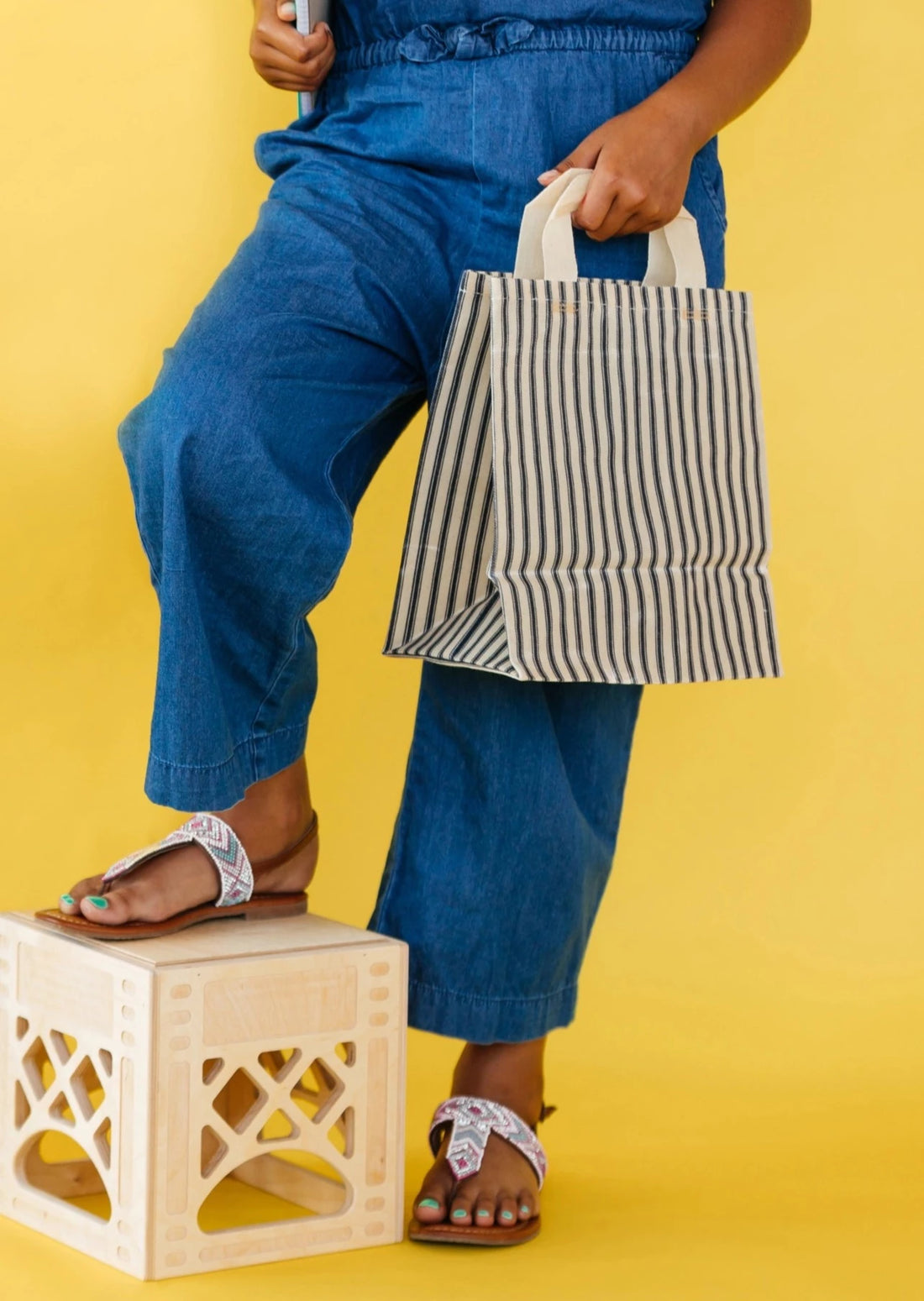 Model Holding Eco-Friendly Market Bag in Navy Ticking