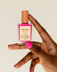 Hand Holding Pitaya Nail Polish by BKIND