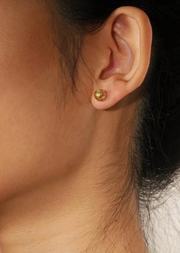 Model Wearing Woven Ball Stud Earrings