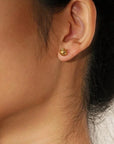 Model Wearing Woven Ball Stud Earrings