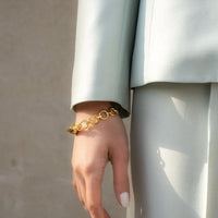 Models Hand by Side Wearing Gentlewomans Agreement Bracelet in Gold