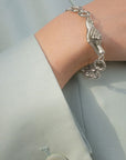 Model Wearing Gentlewoman's Agreement Bracelet In Silver