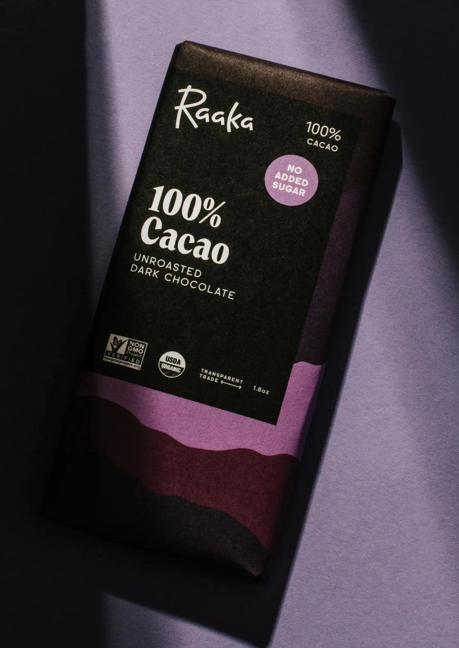 flatlay of 100% cacao bar with dramatic purple sunflare lighting