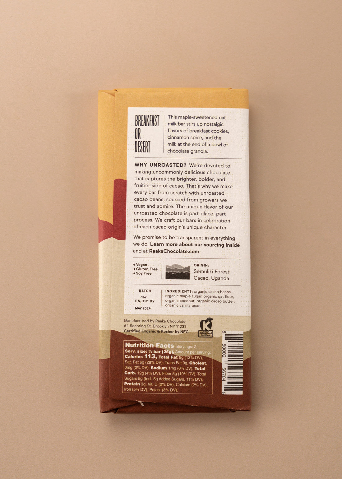 backside flatlay of the oat milk chocolate bar by Raaka with details on the ingredients, why they use unroasted chocolate, and nutrition facts