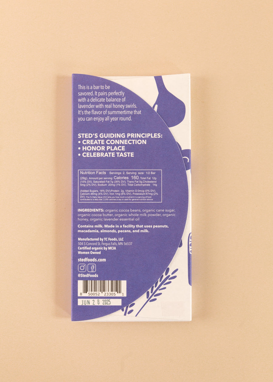 backside flatlay of the honey lavender sted 50% dark chocolate bar, with details on the ingredients and nutrition facts