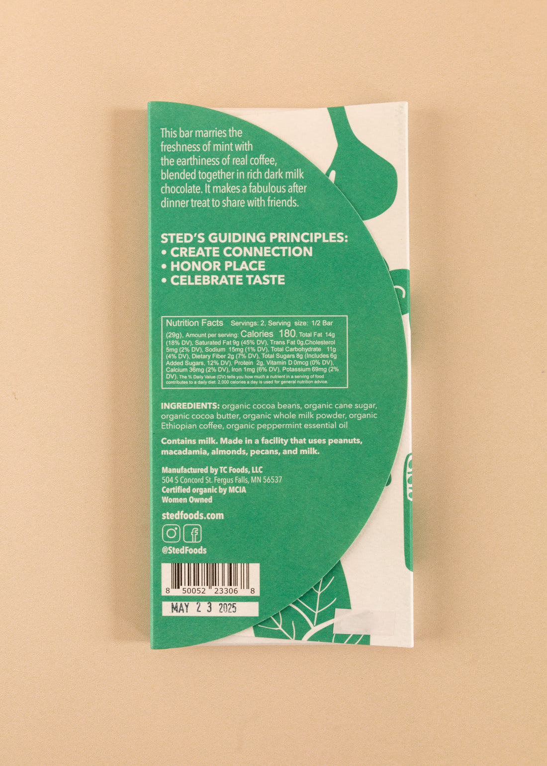 backside flatlay of the mint mocha sted 50% dark milk chocolate bar, with details on the ingredients and nutrition facts