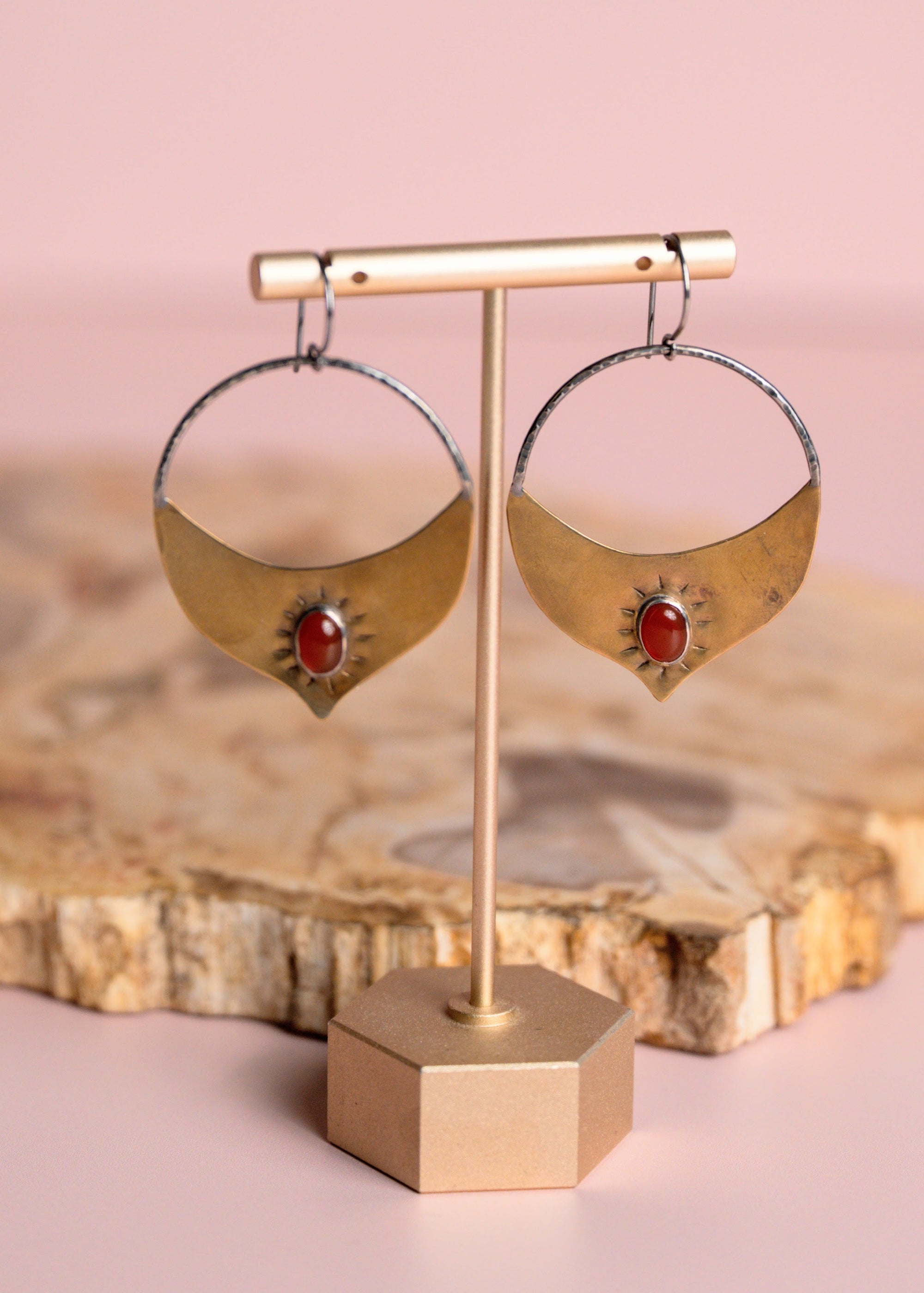 Gold Brass and Silver Madrasa hoop earrings with red stones by Claire Sommer Buck.