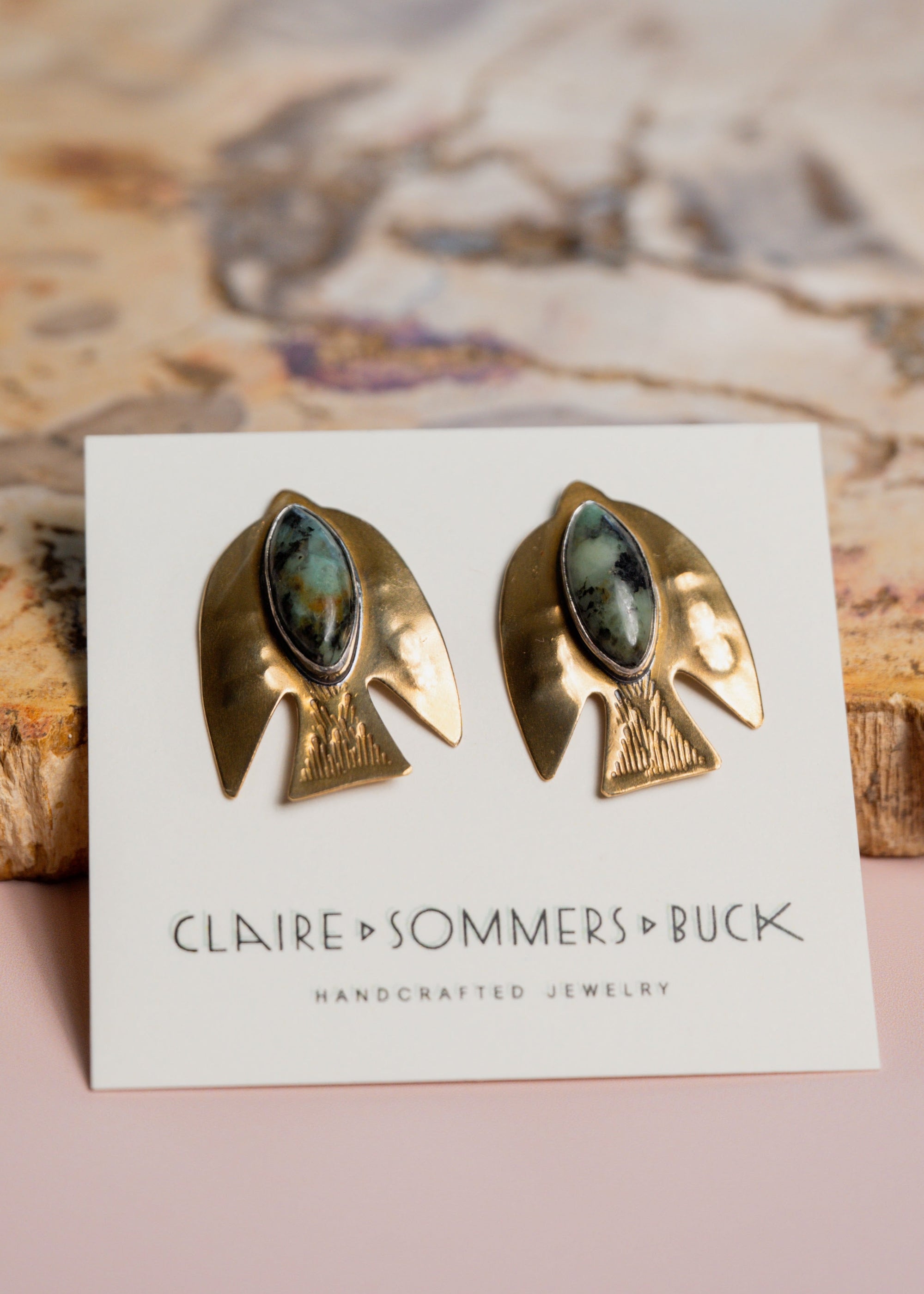 Paloma bird earrings with green gemstones by Claire Sommers Buck