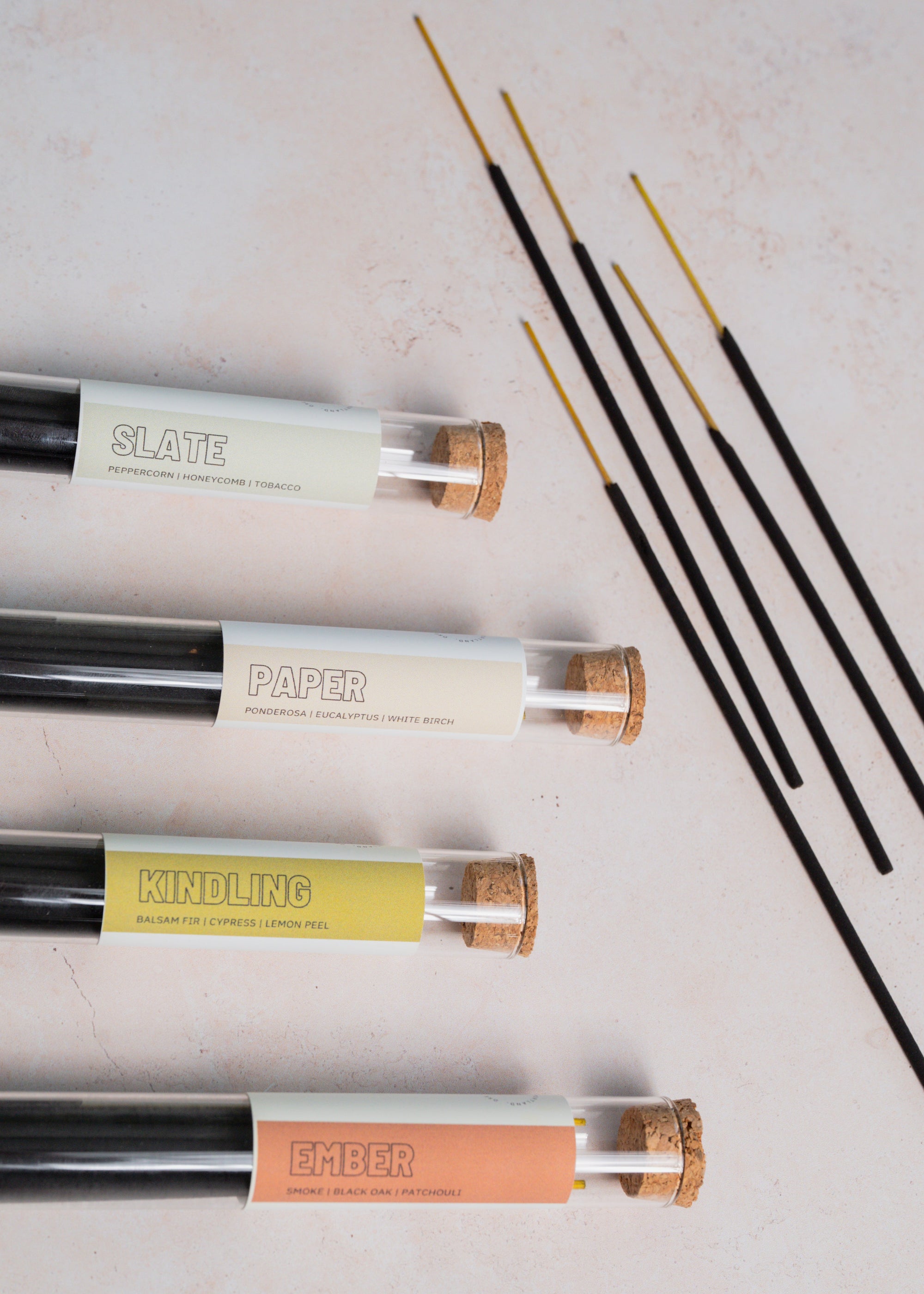 Set of incense sticks on a pale background