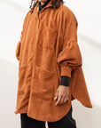 Model wearing a rust-colored shacket 