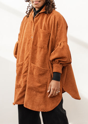 Model wearing a rust-colored shacket 