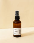 A single amber spray bottle of hair perfume, Garnet