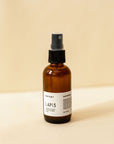 A single amber spray bottle of hair perfume, Lapis