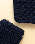 Close-up of two dark blue eco-friendly handmade dish scrubbies