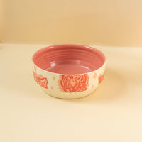 cream bowl with pink tigers printed on it.
