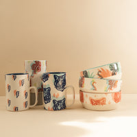 A variety of bowls and mugs with an assortment of tiger prints